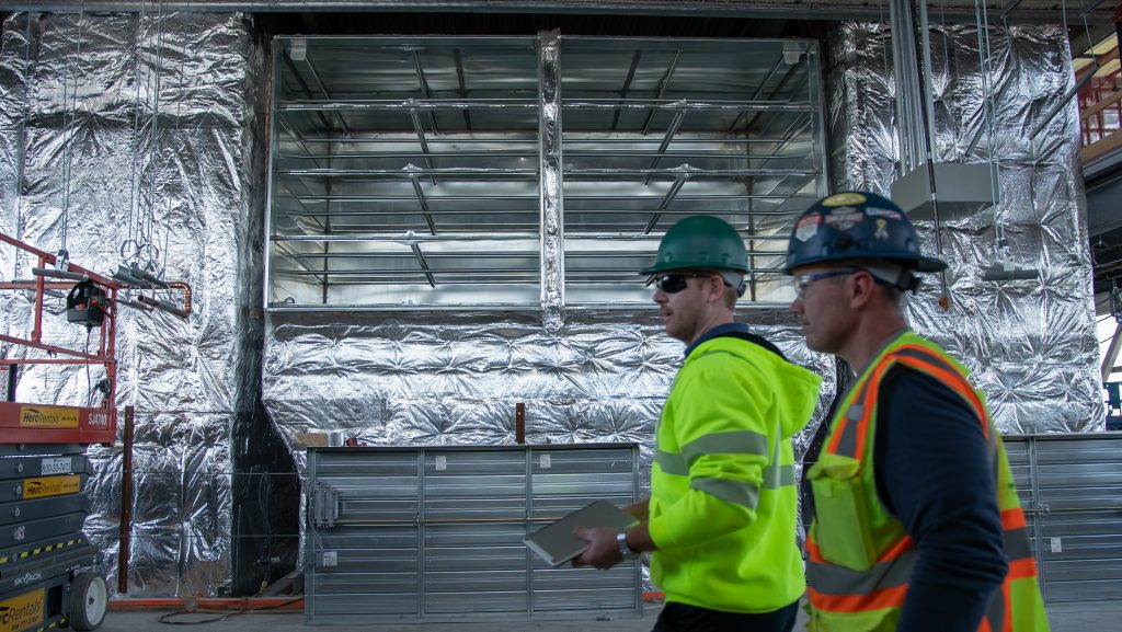 2 Men Checking Ductwork