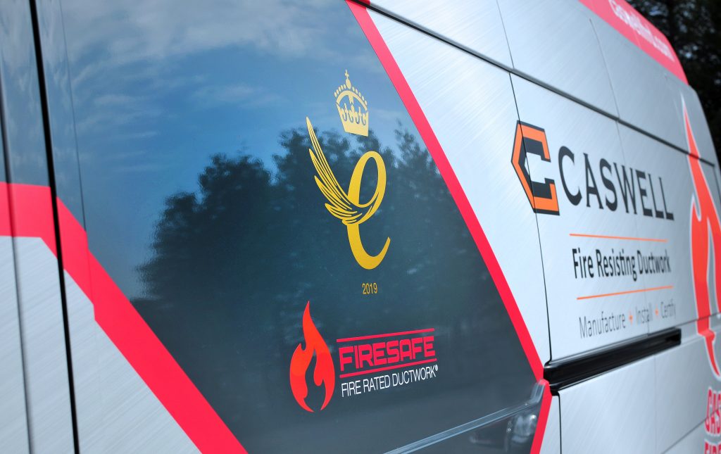 side of caswell frd delivery van with queens award logo